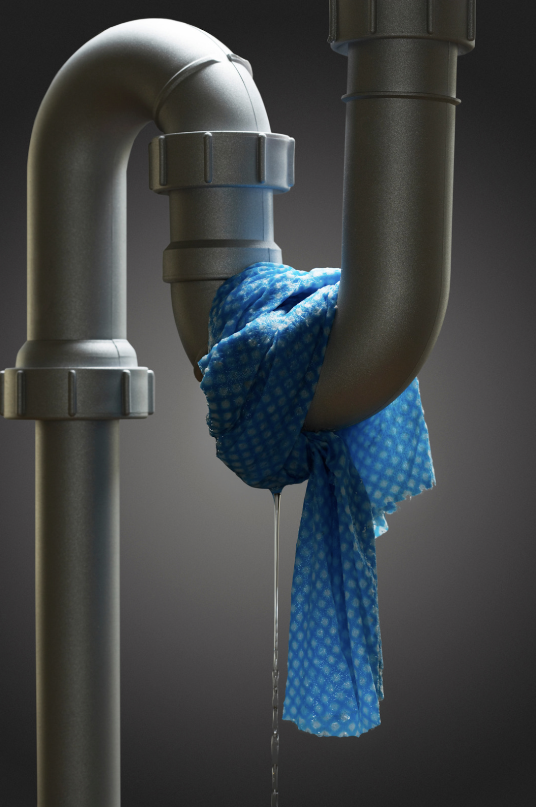 Leaking pipe with a cloth tied around it.